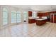 Spacious kitchen with tiled floors, large windows, and wooden cabinets at 1806 Wynthrop Manor Sw Dr, Marietta, GA 30064
