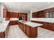 Modern kitchen with an island cooktop, wooden cabinetry, and recessed lighting at 1806 Wynthrop Manor Sw Dr, Marietta, GA 30064