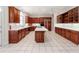 Gourmet kitchen featuring a large island, white countertops, and ample wooden cabinetry at 1806 Wynthrop Manor Sw Dr, Marietta, GA 30064