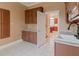 Cozy laundry room with upper and lower cabinets with a sink at 1806 Wynthrop Manor Sw Dr, Marietta, GA 30064