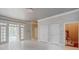 Spacious living room with tile floors, natural light, and multiple access points at 1806 Wynthrop Manor Sw Dr, Marietta, GA 30064
