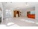 Open concept living room with tile flooring, fireplace, and direct access to the outdoors through French doors at 1806 Wynthrop Manor Sw Dr, Marietta, GA 30064