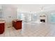 Bright living room with fireplace, tile floors, and large windows allowing plenty of natural light at 1806 Wynthrop Manor Sw Dr, Marietta, GA 30064