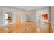 Spacious living room featuring gleaming hardwood floors, moldings, and french doors at 1806 Wynthrop Manor Sw Dr, Marietta, GA 30064
