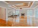 Spacious main bedroom with fireplace, chandelier, tray ceiling and hardwood floors at 1806 Wynthrop Manor Sw Dr, Marietta, GA 30064