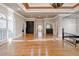 Spacious main bedroom featuring hardwood floors, fireplace, and access to a wet bar at 1806 Wynthrop Manor Sw Dr, Marietta, GA 30064