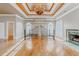 Spacious main bedroom with fireplace, chandelier, tray ceiling and hardwood floors at 1806 Wynthrop Manor Sw Dr, Marietta, GA 30064