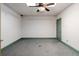 Empty room with carpeting, ceiling fan, shelving and a door at 1806 Wynthrop Manor Sw Dr, Marietta, GA 30064