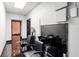 This salon features a shampoo bowl, mirror, styling chairs, and tiled flooring at 1806 Wynthrop Manor Sw Dr, Marietta, GA 30064