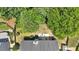 Aerial view of home with patio, lush backyard, and mature trees showing privacy at 204 Sawtooth Ct, Canton, GA 30114
