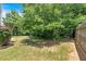 Wooded backyard with a well maintained lawn provides a serene outdoor setting at 204 Sawtooth Ct, Canton, GA 30114