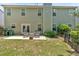 Spacious backyard with grassy area and stone patio great for entertaining or relaxing at 204 Sawtooth Ct, Canton, GA 30114