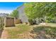 Backyard featuring an outbuilding and well-maintained lawn for outdoor activities and storage at 204 Sawtooth Ct, Canton, GA 30114