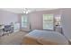 Light and airy bedroom with two windows, neutral carpet, and a white bed at 204 Sawtooth Ct, Canton, GA 30114