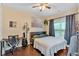 Comfortable bedroom featuring a queen-size bed, desk, and natural light at 204 Sawtooth Ct, Canton, GA 30114