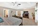 Comfortable bedroom with plush carpet, tray ceiling, and large windows at 204 Sawtooth Ct, Canton, GA 30114