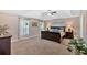 Large main bedroom featuring a trey ceiling, sitting area, and ample natural light at 204 Sawtooth Ct, Canton, GA 30114