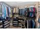 Walk-in closet with metal shelving and rods for ample storage of clothes, shoes, and accessories at 204 Sawtooth Ct, Canton, GA 30114