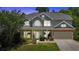 Charming two-story home with a well-manicured lawn, lush landscaping, and inviting front porch at 204 Sawtooth Ct, Canton, GA 30114