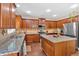 Modern kitchen featuring granite countertops, stainless steel appliances, and ample cabinet space at 204 Sawtooth Ct, Canton, GA 30114
