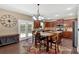 Bright eat-in kitchen with island, stainless appliances, granite counters and backyard access at 204 Sawtooth Ct, Canton, GA 30114
