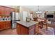 Spacious kitchen showcasing stainless steel appliances and a central island with granite countertop at 204 Sawtooth Ct, Canton, GA 30114