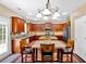 Charming kitchen with granite counters, wooden cabinets, and a cozy dining area at 204 Sawtooth Ct, Canton, GA 30114