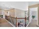 Upper-level landing with carpet, showcasing open hallway and railing at 204 Sawtooth Ct, Canton, GA 30114