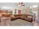 Open-concept living room with hardwood floors connecting to the kitchen and dining area at 204 Sawtooth Ct, Canton, GA 30114