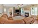Cozy living room with fireplace, large TV, comfortable seating, and natural light at 204 Sawtooth Ct, Canton, GA 30114