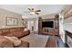 Spacious living room with fireplace, entertainment center, and a comfortable sectional sofa at 204 Sawtooth Ct, Canton, GA 30114