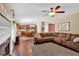 Comfortable living room flows to the kitchen, featuring a fireplace and expansive sectional at 204 Sawtooth Ct, Canton, GA 30114