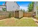 Backyard shed, enclosed by a wooden fence, provides secure outdoor storage at 204 Sawtooth Ct, Canton, GA 30114