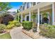 Pathway to front porch adorned with landscaping and hanging plants at 204 Sawtooth Ct, Canton, GA 30114