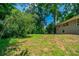 Large backyard with ample green space and mature trees, perfect for outdoor activities and enjoying nature at 3904 W Hilda Cir, Decatur, GA 30035