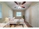 Comfortable bedroom featuring neutral walls, ceiling fan, and cozy decor at 3904 W Hilda Cir, Decatur, GA 30035