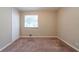 Neutral bedroom featuring carpet, a window, and closet with classic doors at 3904 W Hilda Cir, Decatur, GA 30035