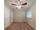 Neutral bedroom featuring carpet, a ceiling fan, and a double door closet at 3904 W Hilda Cir, Decatur, GA 30035
