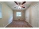 Neutral bedroom featuring carpet, a ceiling fan, and a closet with classic doors at 3904 W Hilda Cir, Decatur, GA 30035