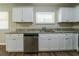 Efficient kitchen features white cabinetry, granite countertops, and stainless steel dishwasher at 3904 W Hilda Cir, Decatur, GA 30035