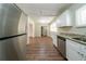 Updated kitchen with stainless steel refrigerator, modern appliances, and sleek countertops at 3904 W Hilda Cir, Decatur, GA 30035