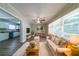 A cozy living room features neutral tones, hardwood floors, and a large window for natural light at 3904 W Hilda Cir, Decatur, GA 30035