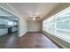 Bright living room featuring hardwood floors, a ceiling fan, and large windows at 3904 W Hilda Cir, Decatur, GA 30035