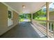 Covered patio with brick columns and a white railing, perfect for enjoying the outdoors at 3904 W Hilda Cir, Decatur, GA 30035