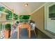 Inviting covered porch with outdoor dining setup, perfect for entertaining guests at 3904 W Hilda Cir, Decatur, GA 30035