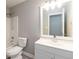Bright bathroom with a shower, toilet and single sink vanity at 1029 Chaterly Ct, Riverdale, GA 30296