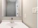 Bathroom featuring a modern sink with a faucet, mirror, updated switches and outlets at 1029 Chaterly Ct, Riverdale, GA 30296