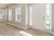 Bright and airy foyer with light wood floors, a large front door and lots of natural light at 1029 Chaterly Ct, Riverdale, GA 30296