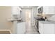Modern kitchen with granite countertops, stainless steel appliances, and light wood floors at 1029 Chaterly Ct, Riverdale, GA 30296