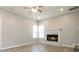 Cozy living room with a fireplace, recessed lighting, light wood floors and corner windows at 1029 Chaterly Ct, Riverdale, GA 30296